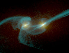 Слияние двух галактик — процесс бурный. Пусть даже и занимает он многие миллионы лет (иллюстрация Josh Barnes, University of Hawaii/John Hibbard, NRAO; NASA).