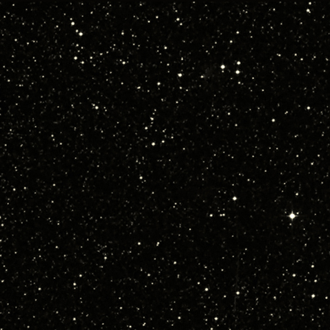 Так выглядит обследованный кусочек неба в обычном, оптическом диапазоне. Ничего особенного не видать, но всё равно красиво (фото Pal.Obs. DSS).